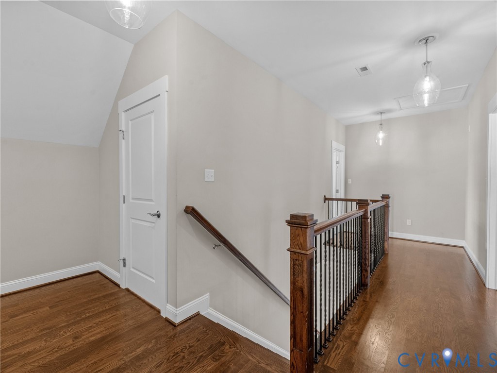 16125 Binley Road Midlothian, VA 23112 - Photo 32 of 50 a view of a hallway with wooden floor and staircase
