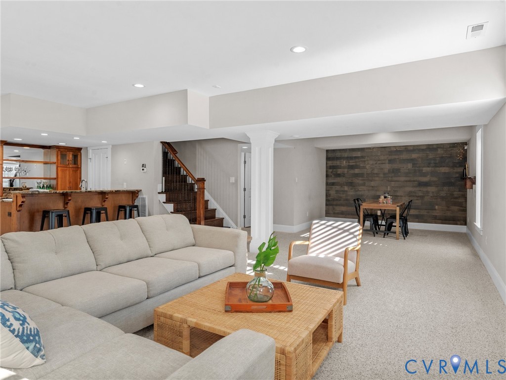 16125 Binley Road Midlothian, VA 23112 - Photo 39 of 50 a living room with furniture and a fireplace