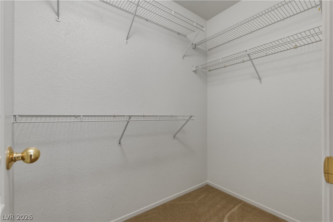29 Olive Tree Henderson, NV 89074 - Photo 45 of 60 This spacious walk-in closet offers ample storage with convenient shelving.