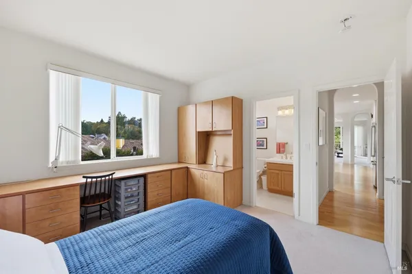 a kitchen with stainless steel appliances granite countertop a refrigerator and wooden cabinets
