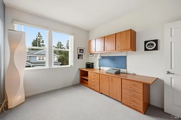 a kitchen with cabinets a window and a sink