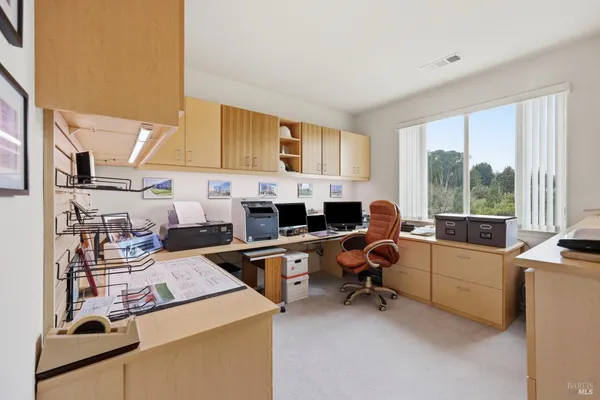 a view of a workspace with kitchen