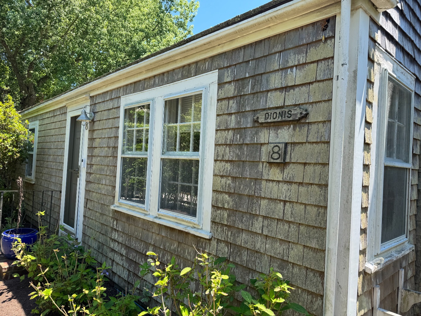 16 H Milestone Road, Unit 8 DIONIS Nantucket, MA 02554 - Photo 1 of 22 a front view of a house with a yard