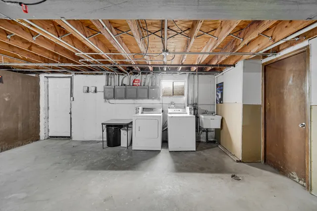 a view of a storage & utility room with a sink