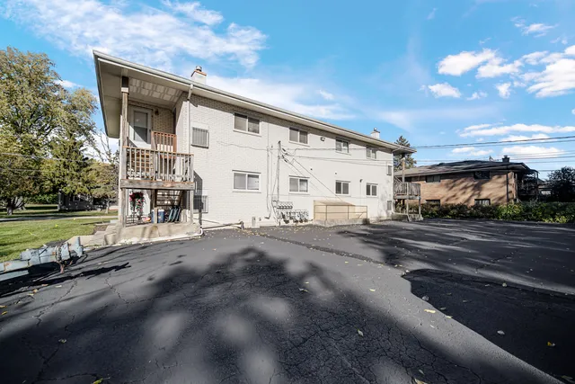 a view of a house with a street