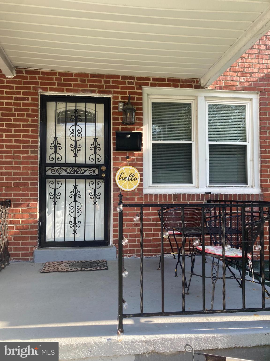 a front view of a house with large windows