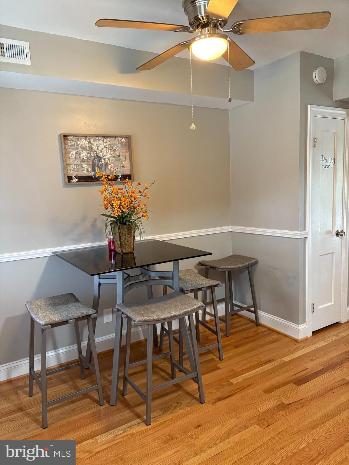 3541 Benzinger Road Baltimore, MD 21229 - Photo 13 of 33 a view of a dining room with furniture and wooden floor