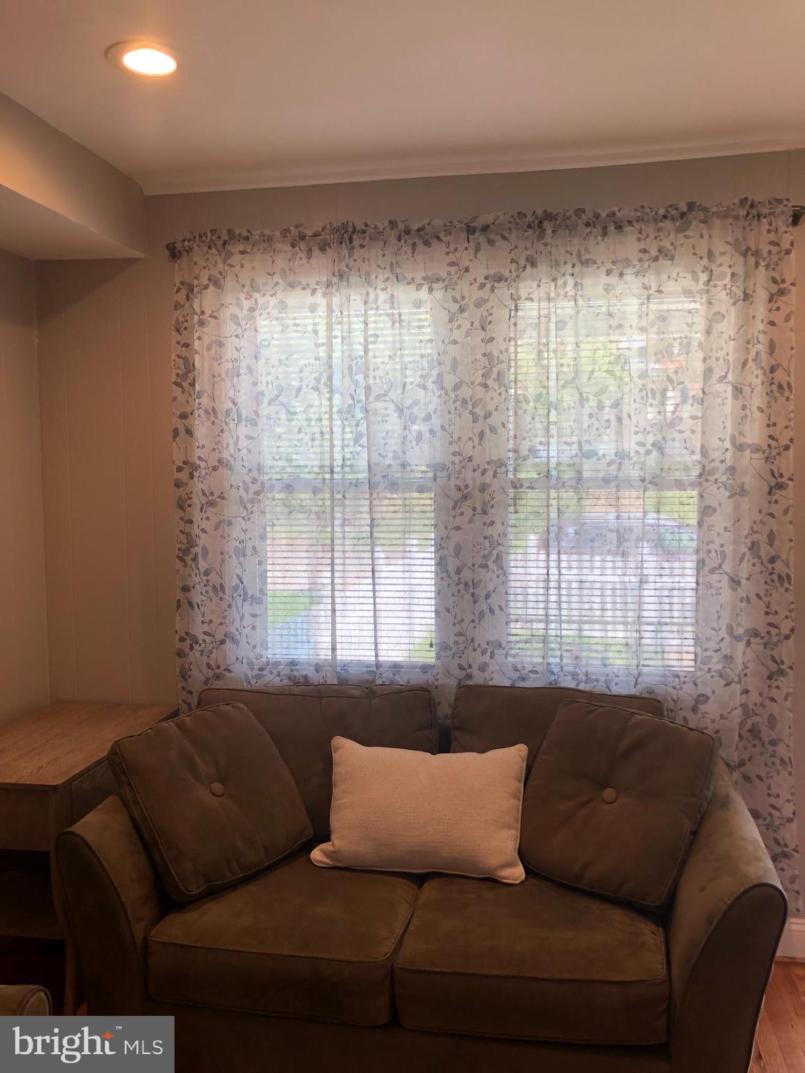 3541 Benzinger Road Baltimore, MD 21229 - Photo 17 of 33 a living room with furniture and a large window
