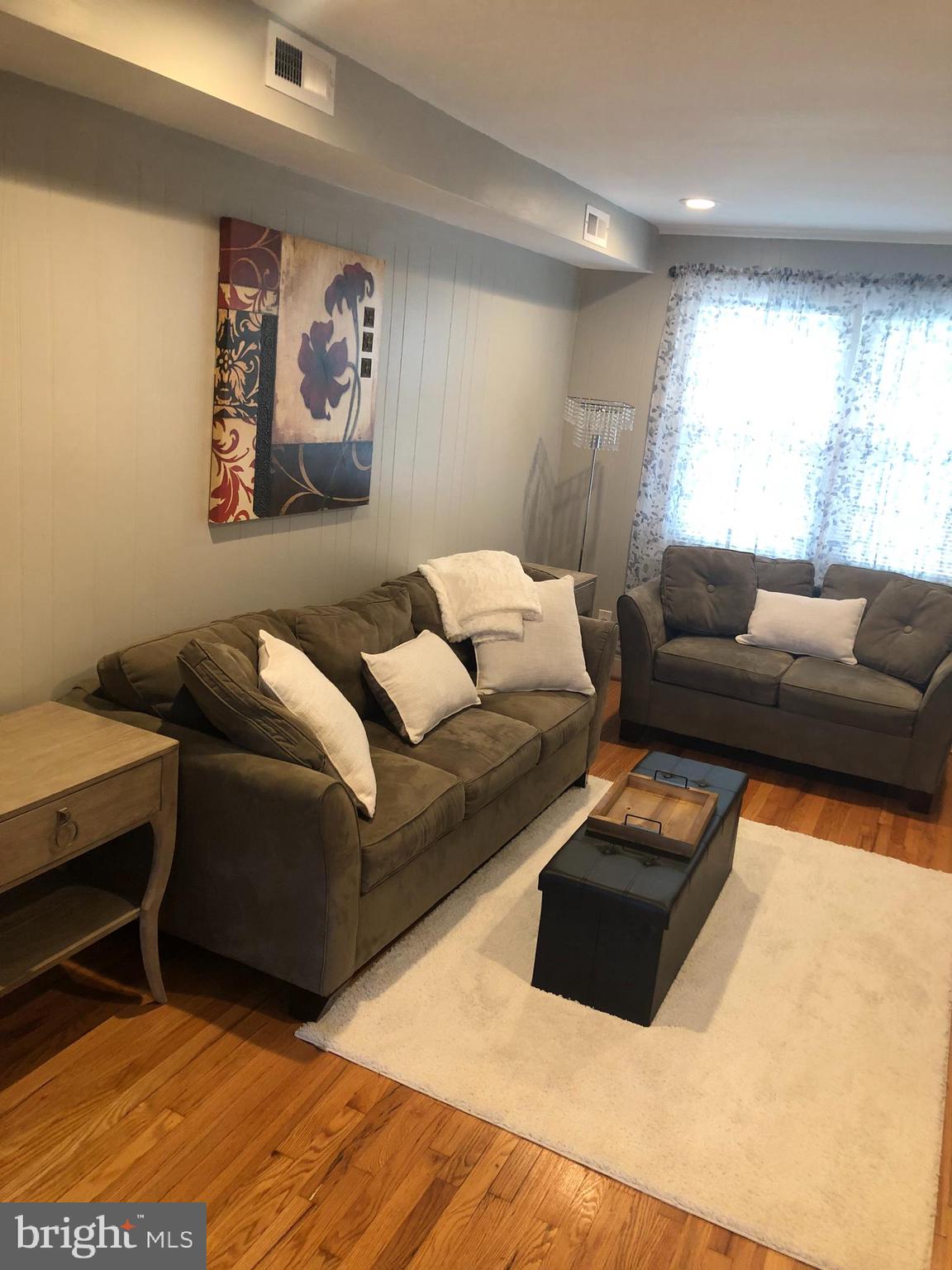 3541 Benzinger Road Baltimore, MD 21229 - Photo 19 of 33 a living room with furniture window and a couch