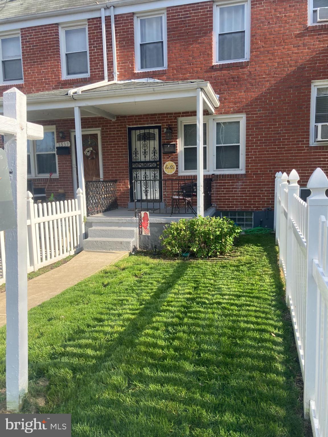3541 Benzinger Road Baltimore, MD 21229 - Photo 2 of 33 a front view of a house with a yard