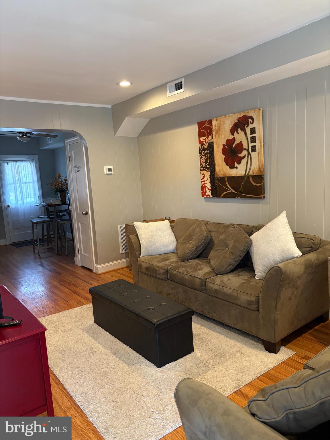 3541 Benzinger Road Baltimore, MD 21229 - Photo 21 of 33 a living room with furniture and wooden floor