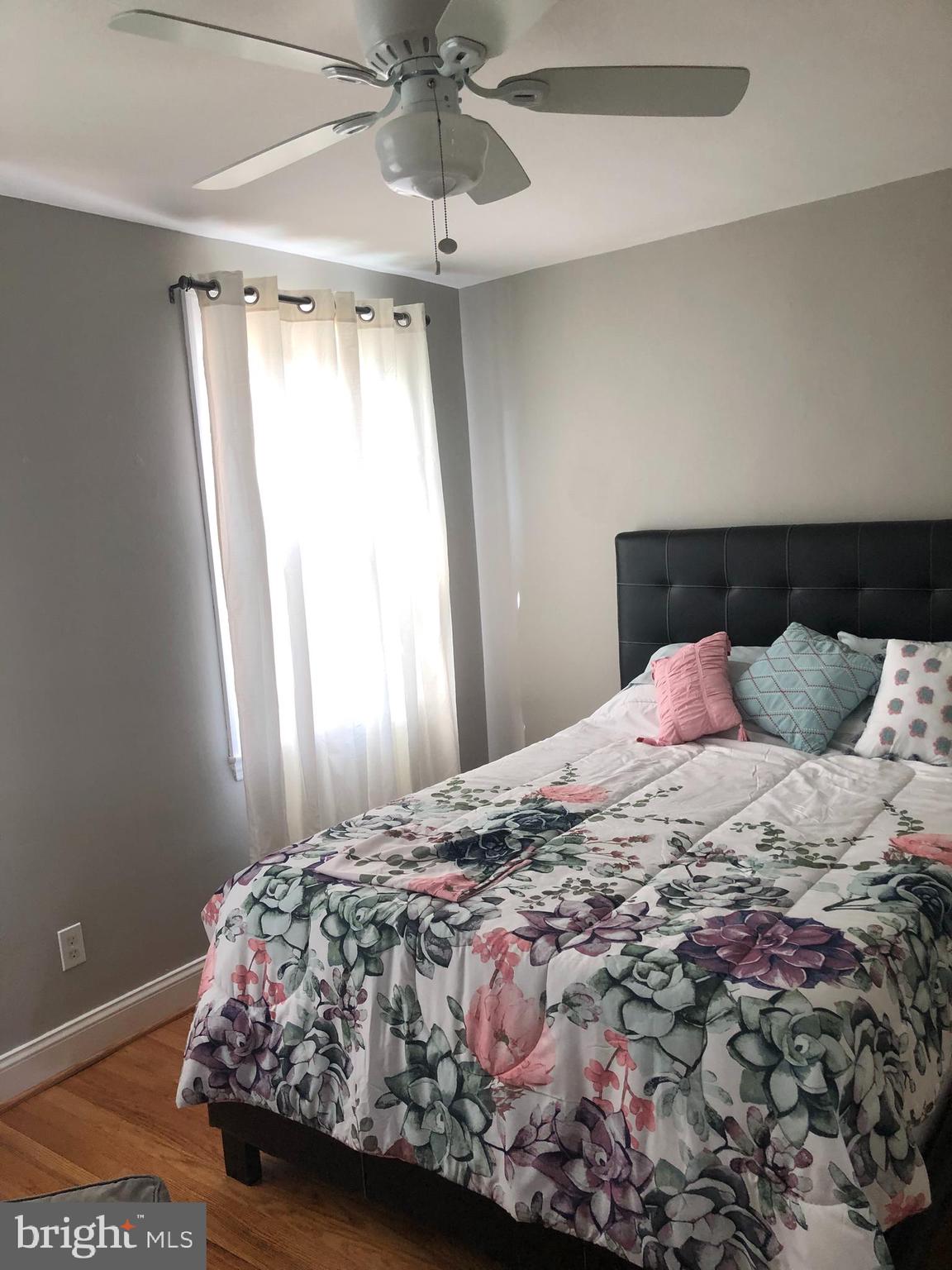 3541 Benzinger Road Baltimore, MD 21229 - Photo 27 of 33 a bedroom with a bed and a window