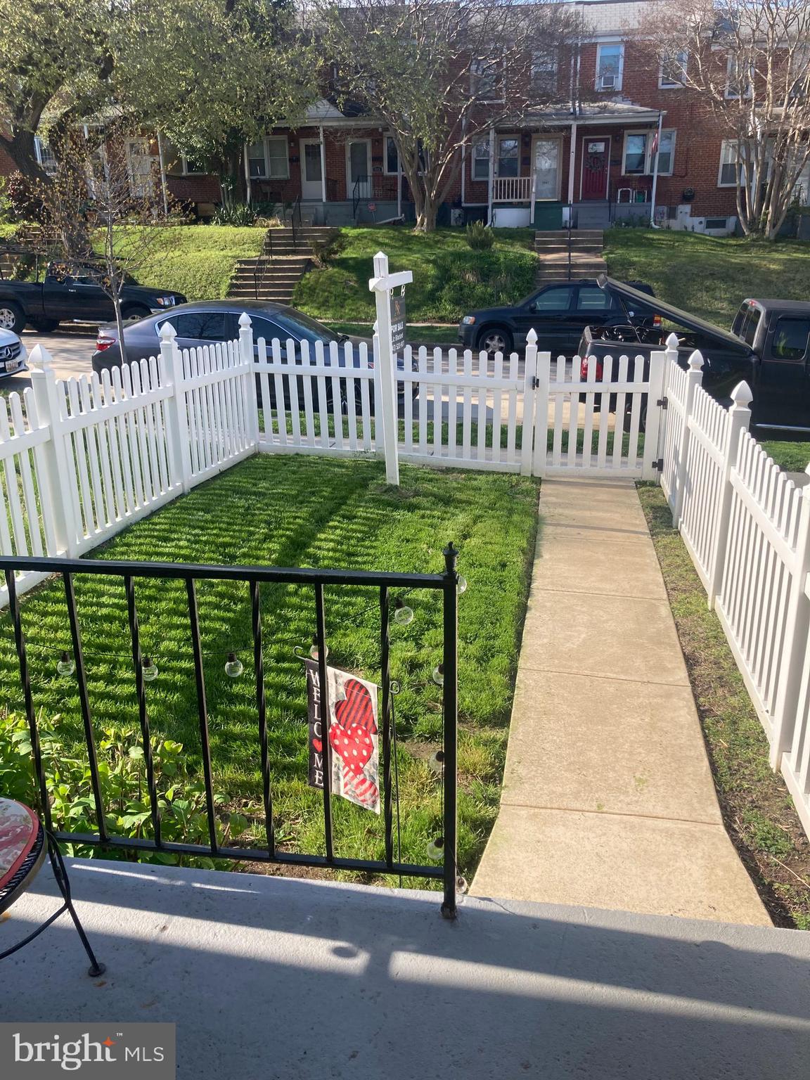 3541 Benzinger Road Baltimore, MD 21229 - Photo 4 of 33 a view of a brick house with a yard and plants