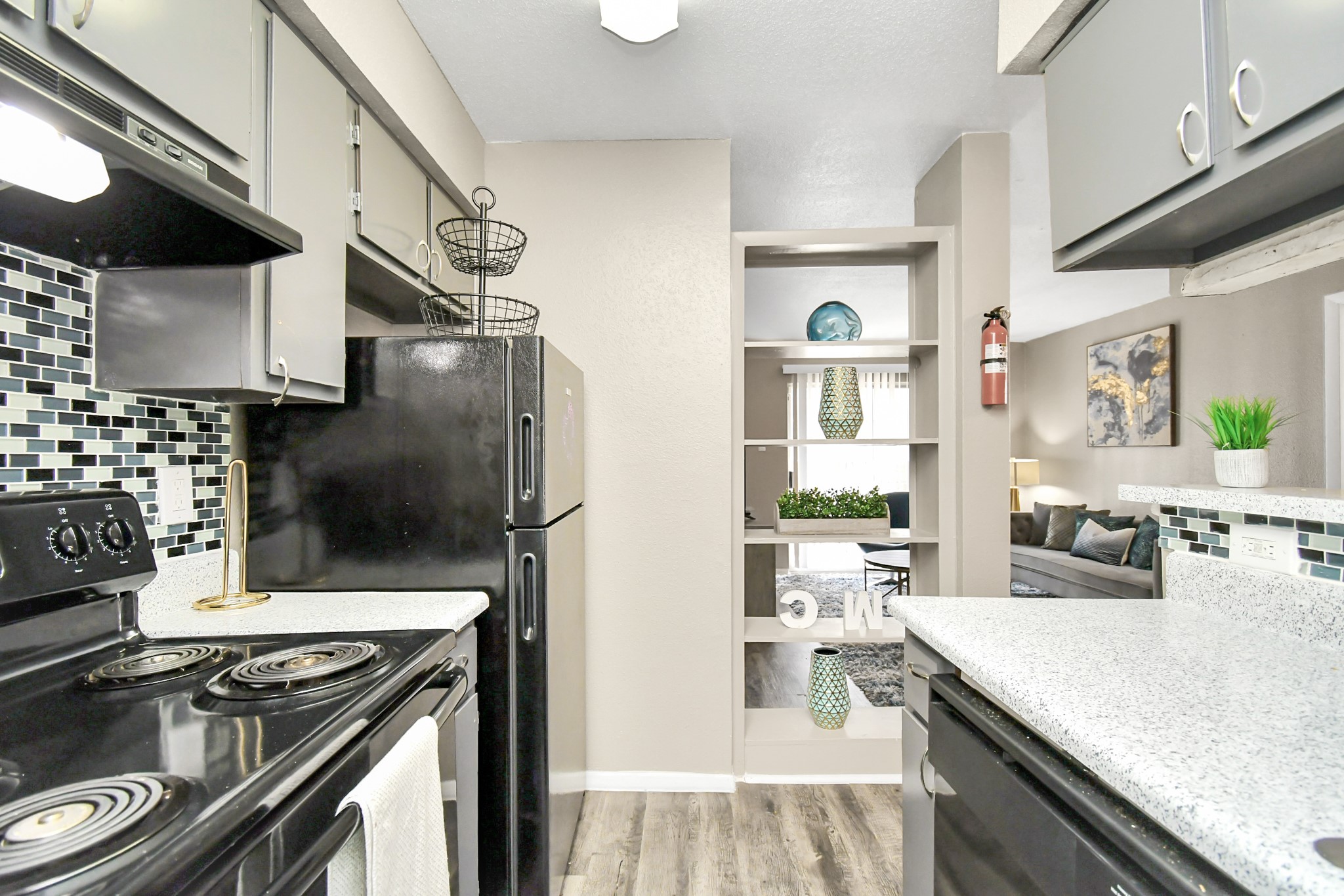 12211 Fondren Road, Unit 708 Houston, TX 77035 - Photo 13 of 30 a kitchen with a stove and a refrigerator