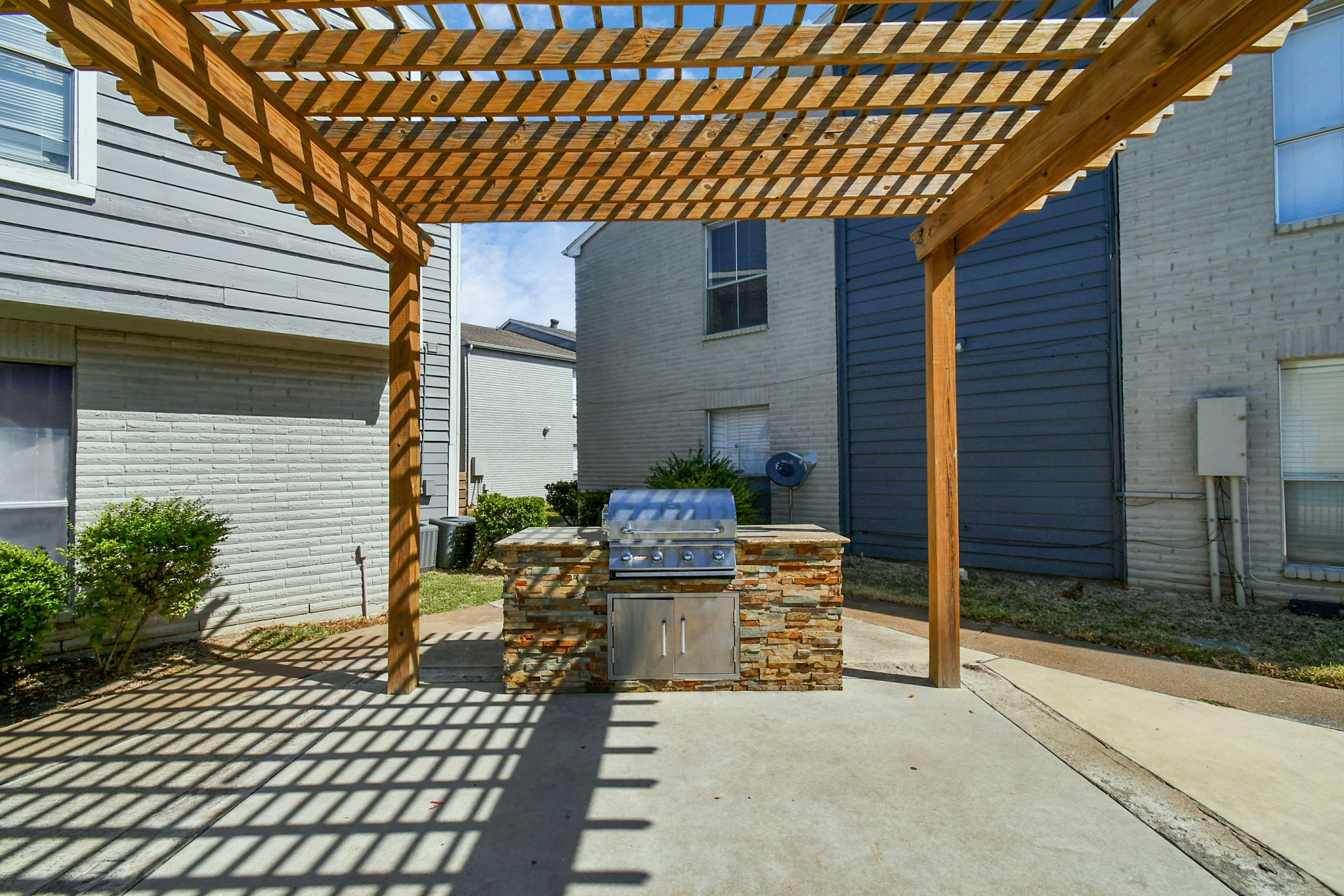 12211 Fondren Road, Unit 708 Houston, TX 77035 - Photo 2 of 30 a backyard of a house with seating space