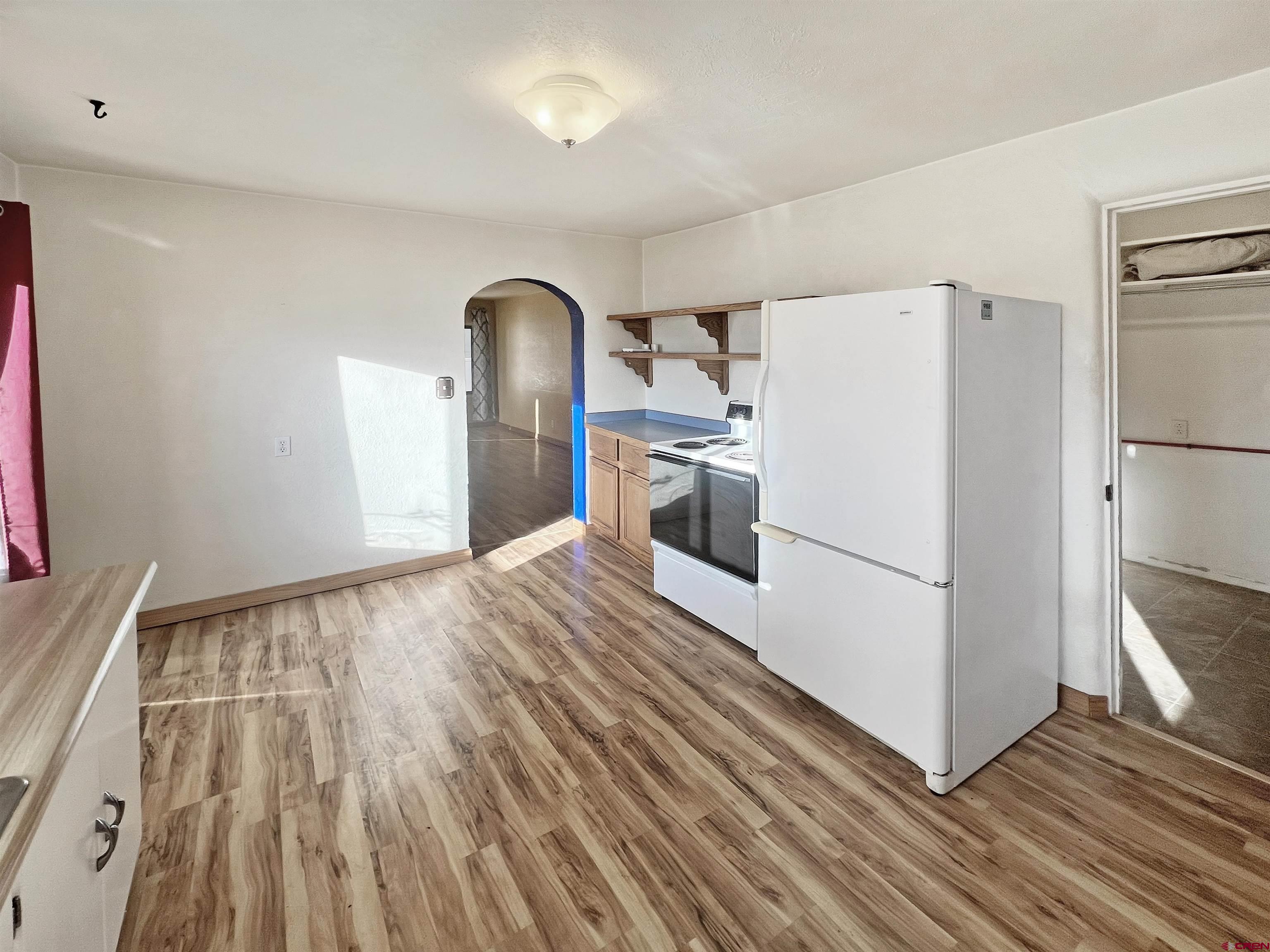 112 North Adams Street Cortez, CO 81321 - Photo 5 of 20 a view of a storage & utility room with washer and dryer
