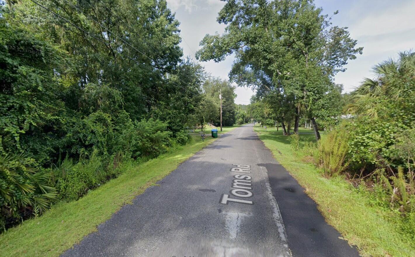 240 Toms Road DeBary, FL 32713 - Photo 3 of 3 a view of a street with a trees