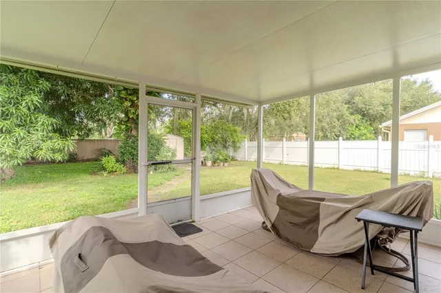 a living room with a large window and table