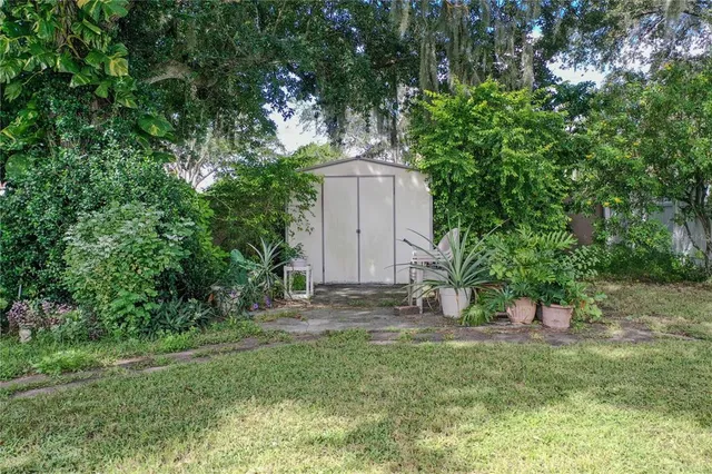 a backyard of a house with lots of green space