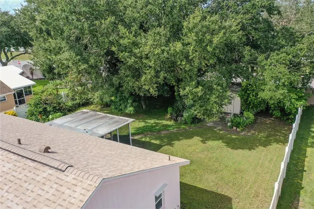 an aerial view of a house with outdoor space and street view