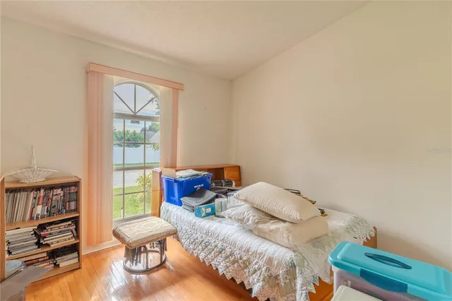 a bedroom with furniture and a window