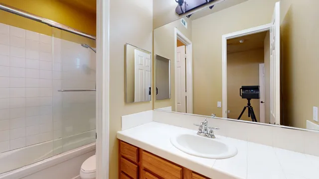 a view of a workspace with furniture and wooden floor