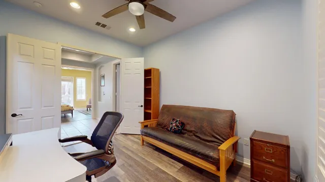 a view of a patio with a table and chairs under an umbrella