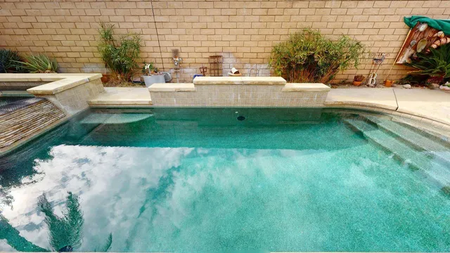 a view of backyard with sitting area