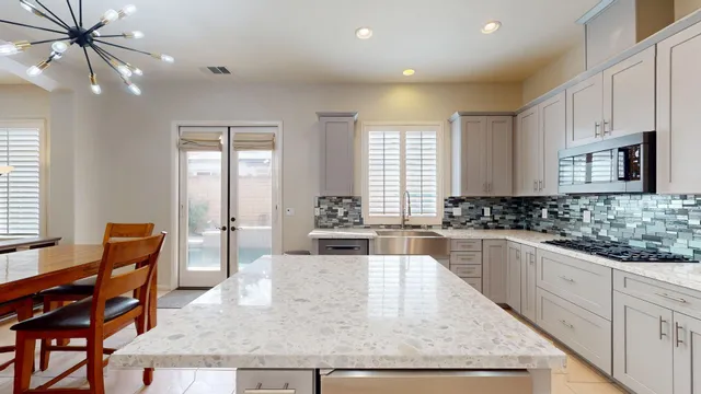 a view of a dining room with furniture and window