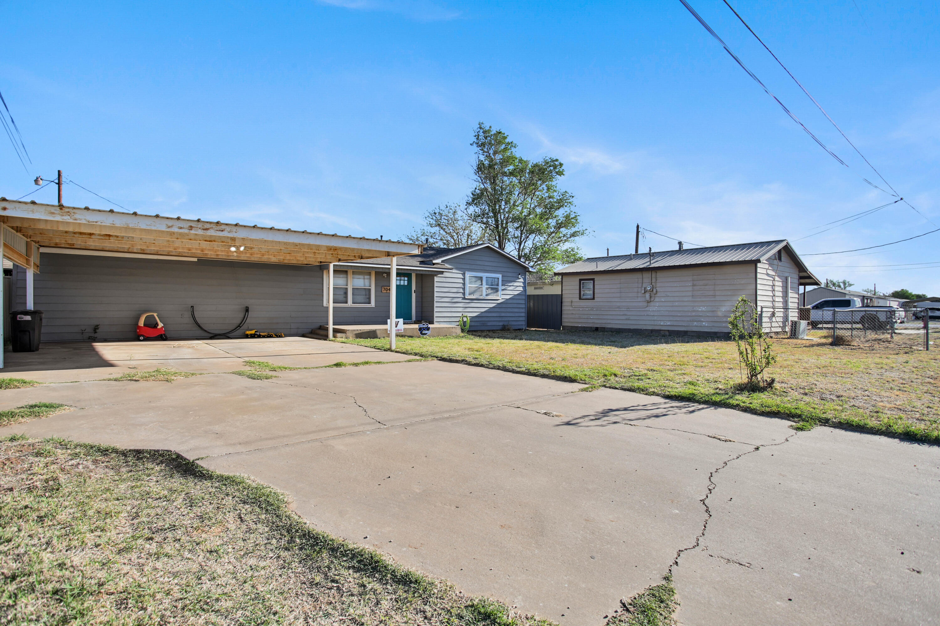 704 4th Street Smyer, TX 79367 - Photo 2 of 38 a front view of a house with a yard
