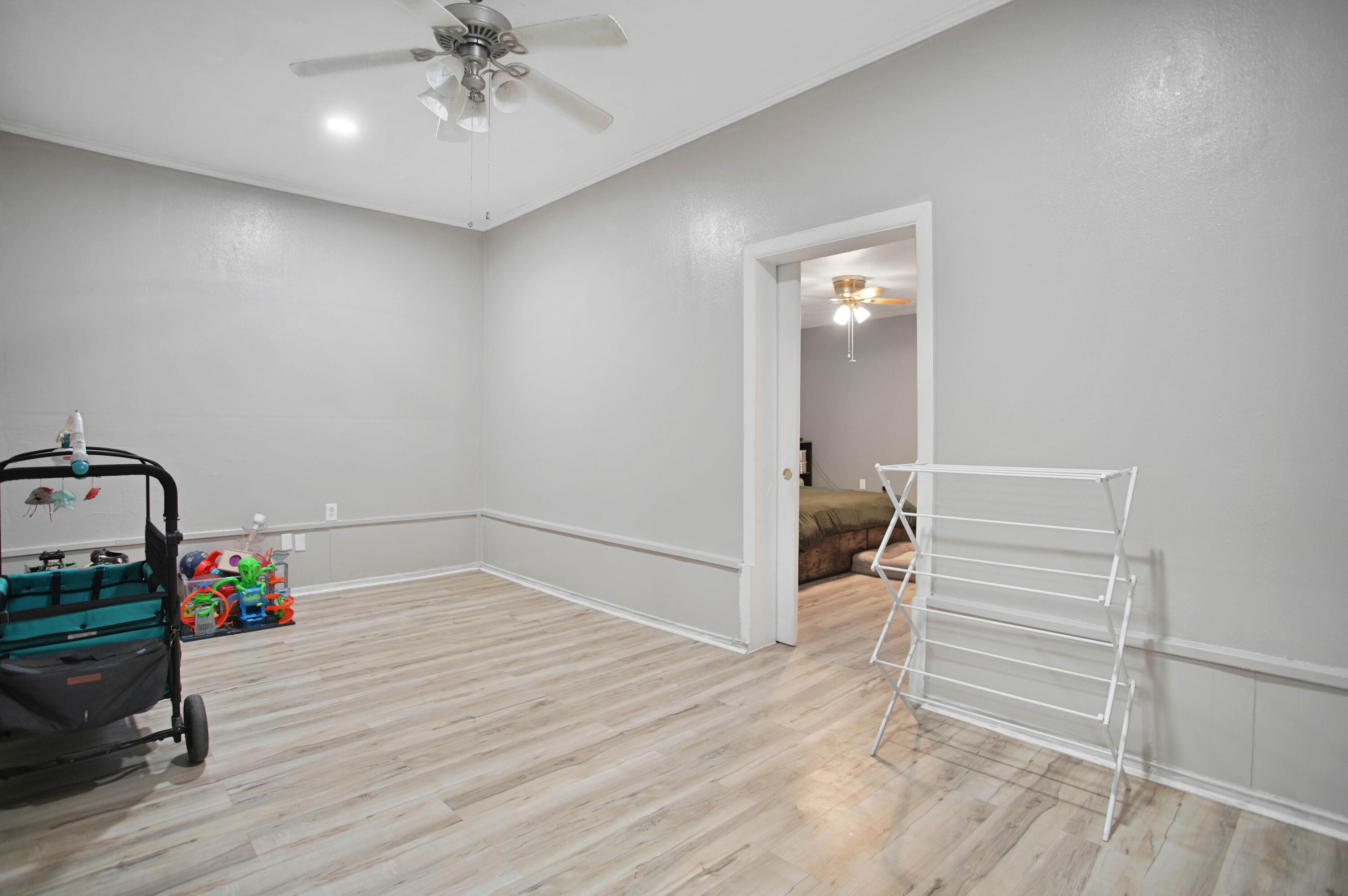 704 4th Street Smyer, TX 79367 - Photo 22 of 38 a view of livingroom with furniture and hardwood floor