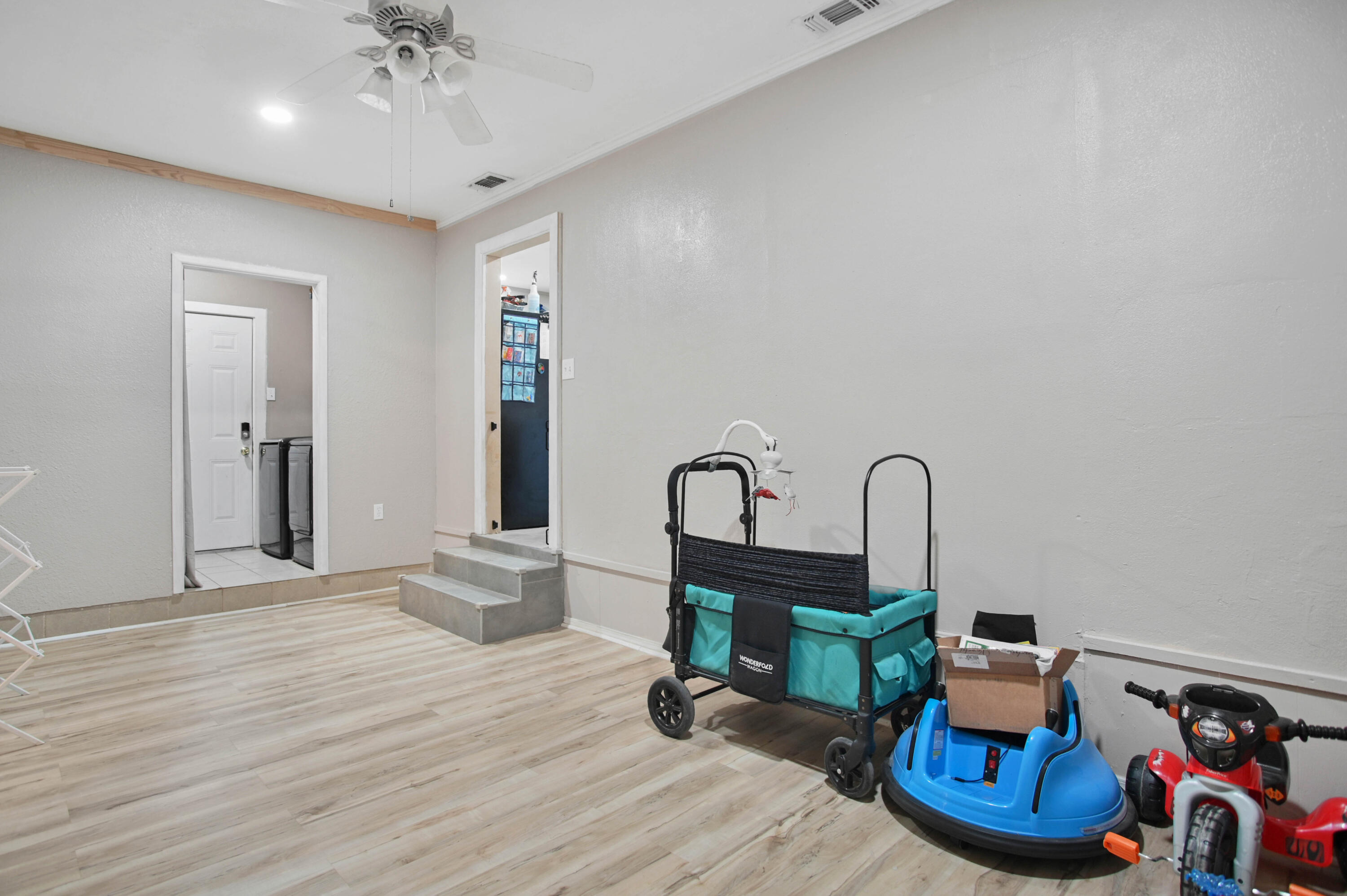 704 4th Street Smyer, TX 79367 - Photo 24 of 38 a room with furniture and wooden floor