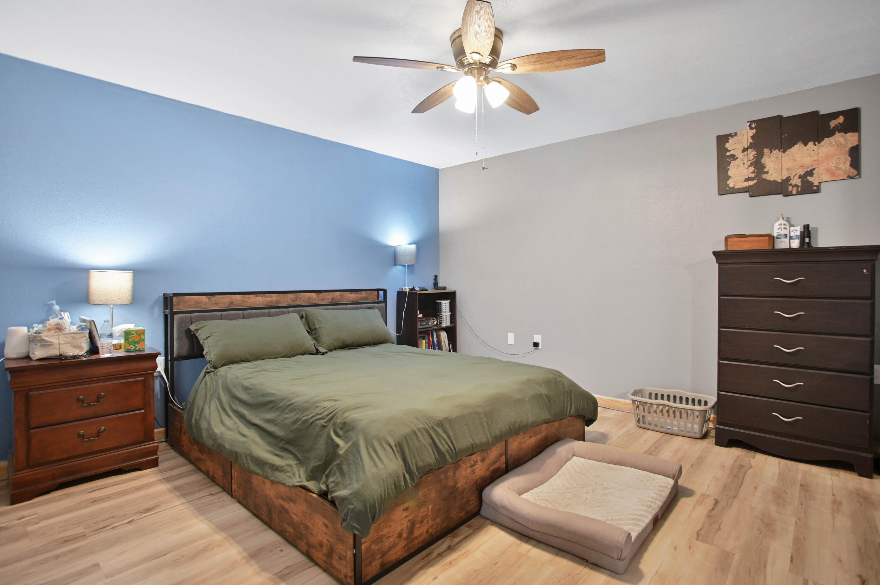 704 4th Street Smyer, TX 79367 - Photo 26 of 38 a bedroom with a bed and a chandelier