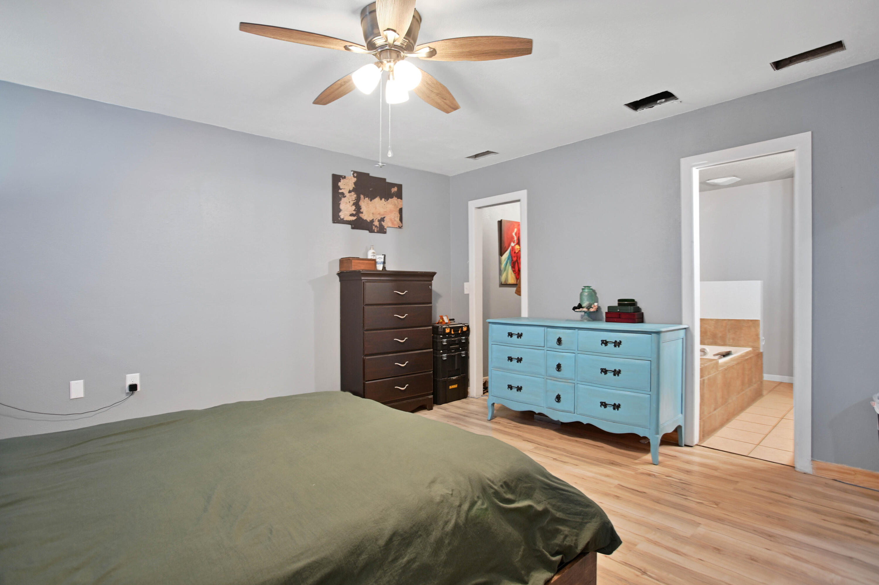 704 4th Street Smyer, TX 79367 - Photo 27 of 38 a bedroom with a bed and a dresser