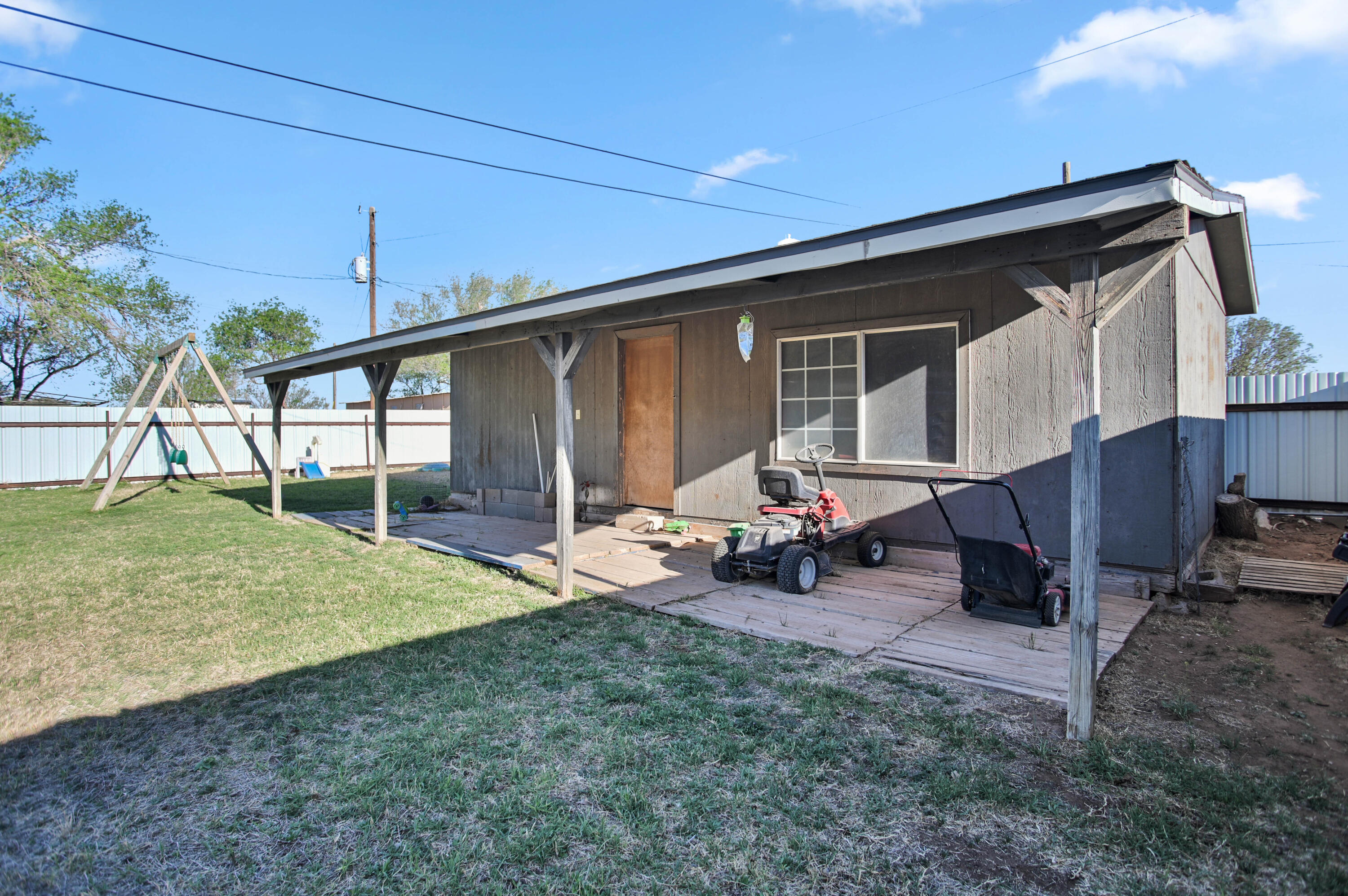 704 4th Street Smyer, TX 79367 - Photo 34 of 38 a backyard of a house with barbeque oven table and chairs
