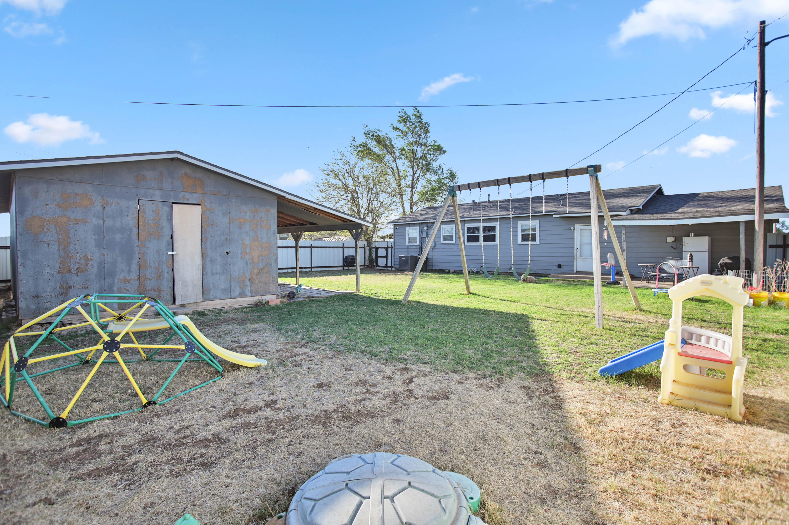 704 4th Street Smyer, TX 79367 - Photo 37 of 38 a view of a house with a backyard