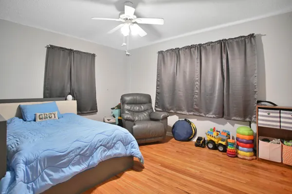 a bedroom with bed and window