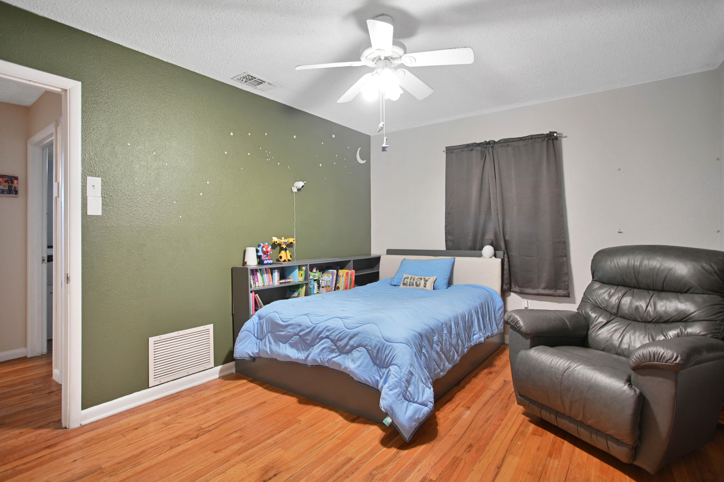 704 4th Street Smyer, TX 79367 - Photo 9 of 38 a bedroom with a bed couch and a window