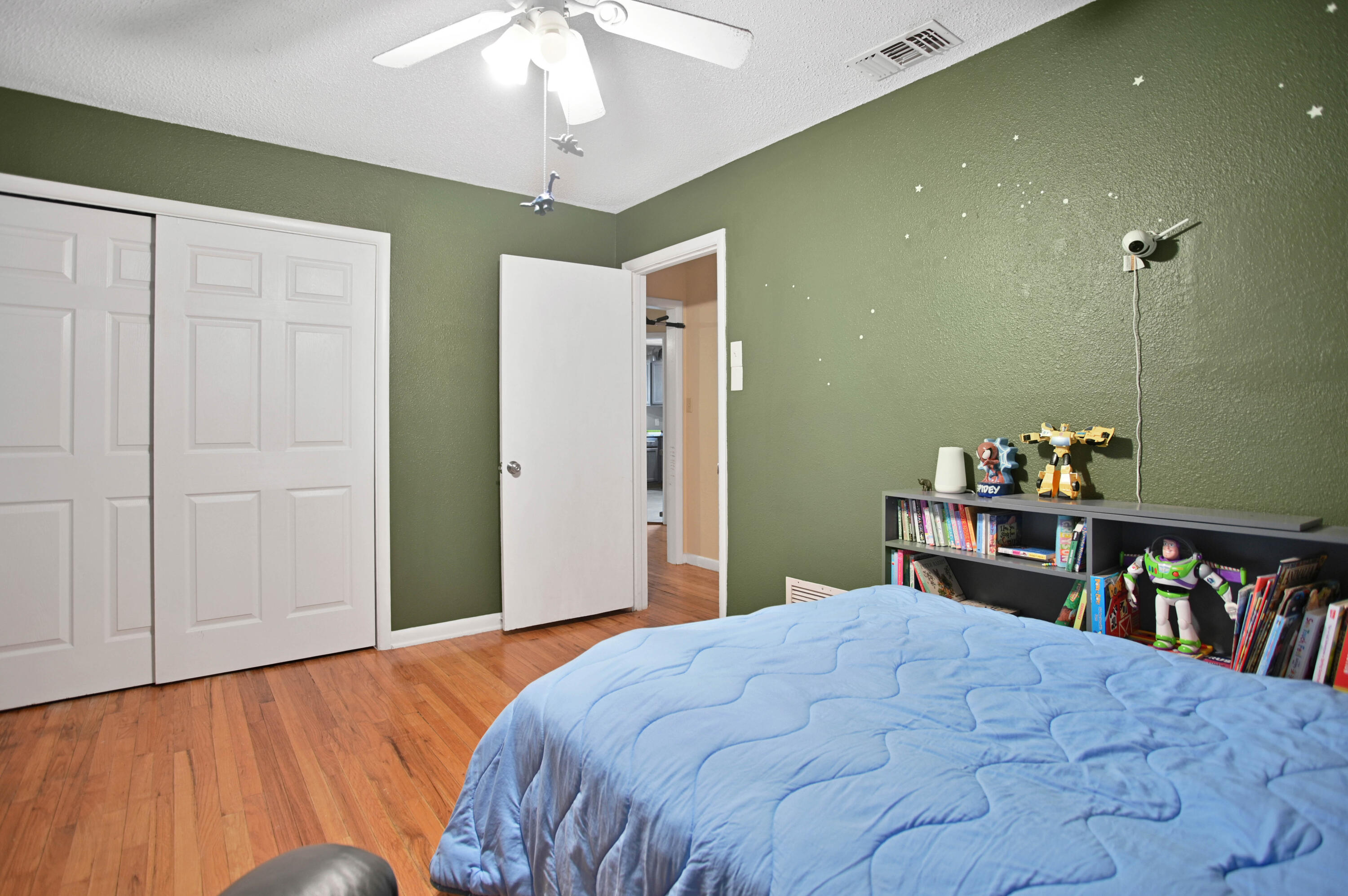 704 4th Street Smyer, TX 79367 - Photo 10 of 38 a bedroom with a bed and a book shelf