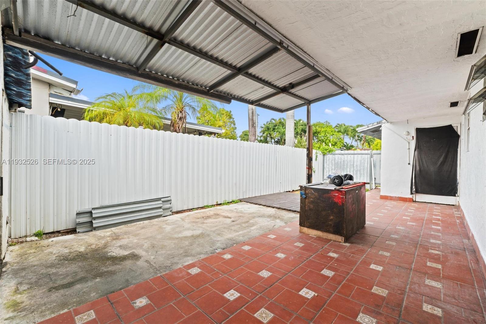11441 Southwest 2nd Street, Unit 11443 Sweetwater, FL 33174 - Photo 12 of 31 a backyard of a house with shaded area