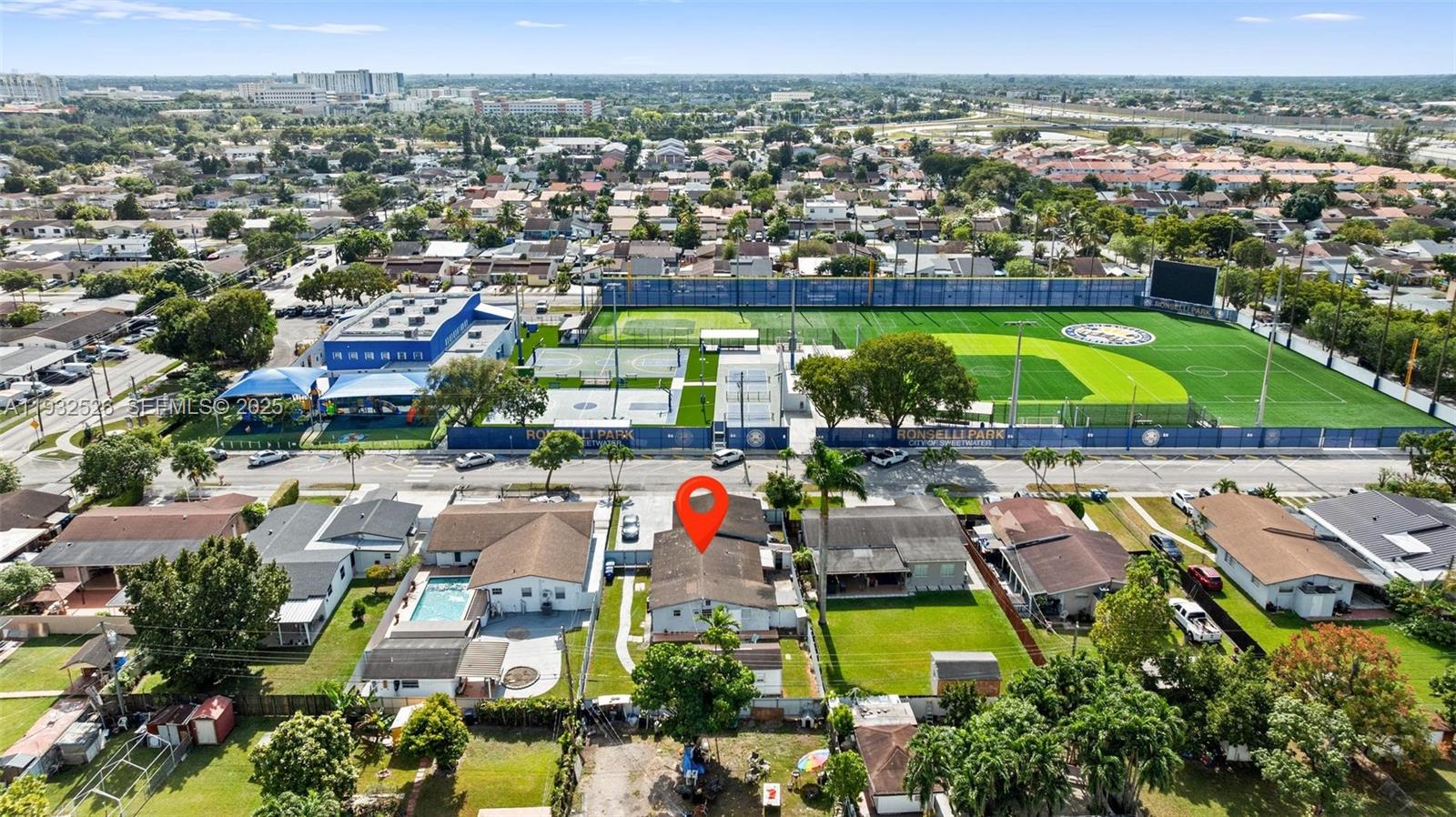 11441 Southwest 2nd Street, Unit 11443 Sweetwater, FL 33174 - Photo 26 of 31 an aerial view of tennis court