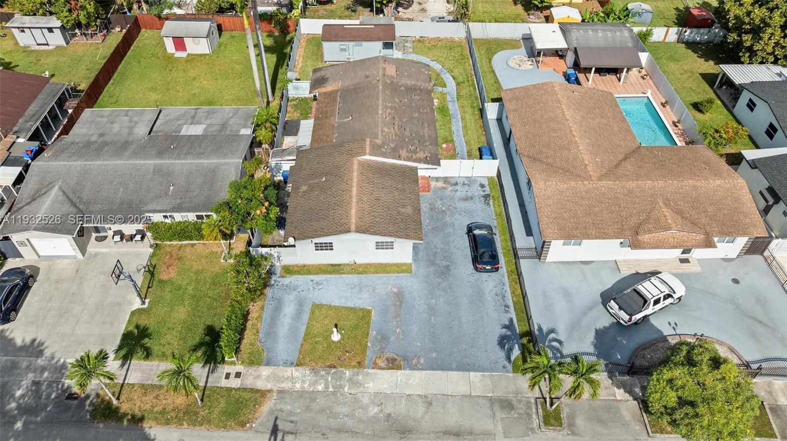 11441 Southwest 2nd Street, Unit 11443 Sweetwater, FL 33174 - Photo 30 of 31 an aerial view of a house with a swimming pool