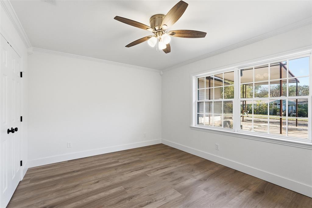 9938 John Flowers Road Wills Point, TX 75169 - Photo 11 of 40 Bedroom featuring wood finished floors, ornamental molding, and a ceiling fan