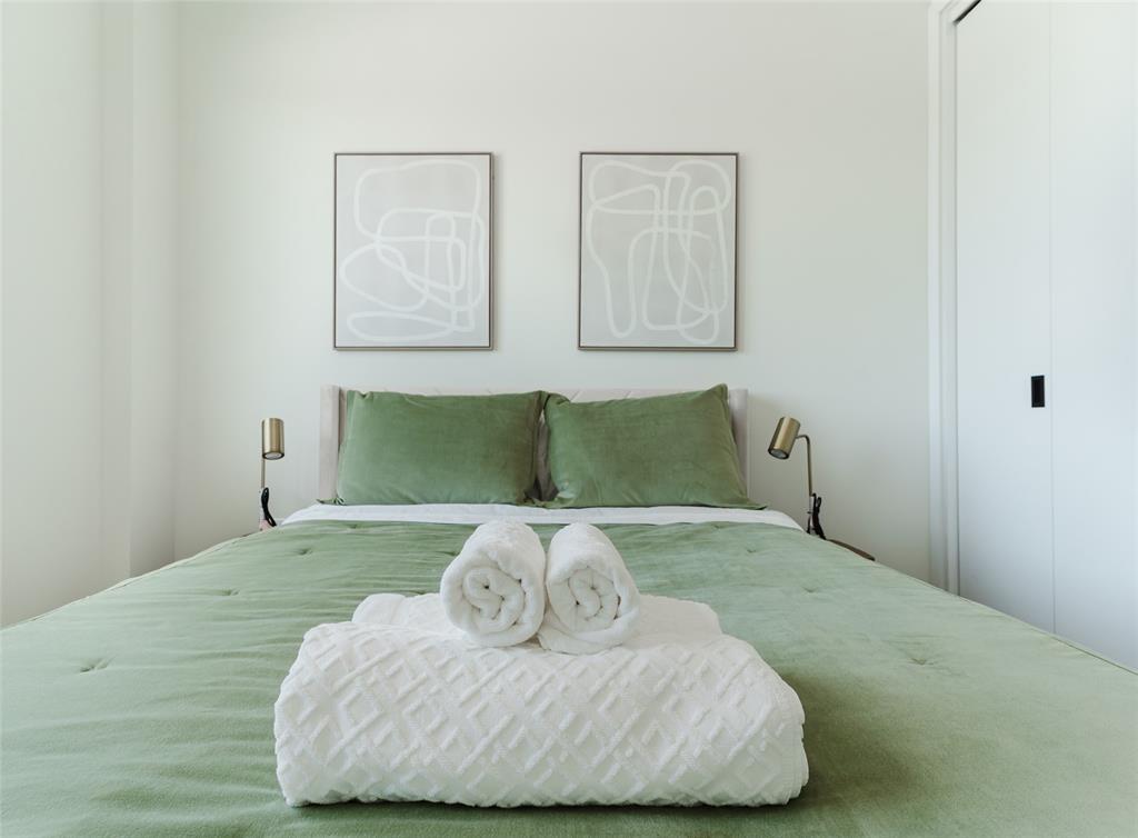 2750 Griffin Road, Unit 309 Fort Lauderdale, FL 33312 - Photo 30 of 47 a bedroom with a bed and painting on the wall