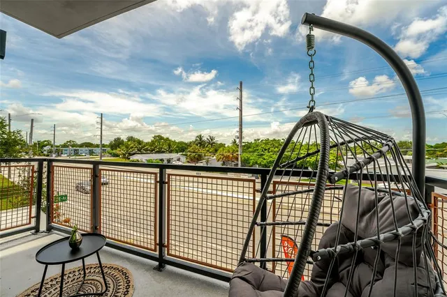 a view of a balcony with furniture