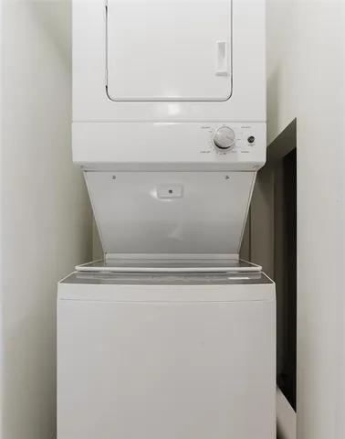 a view of hallway with stainless steel appliances