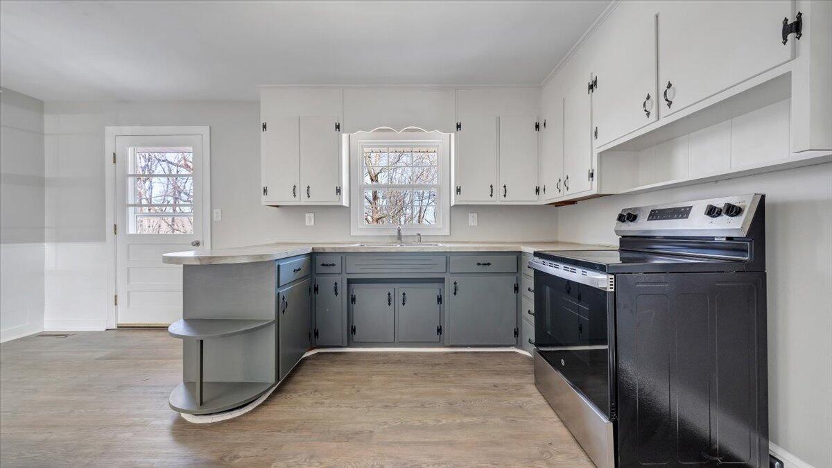 200 Cornell Road Rocky Mount, VA 24151 - Photo 11 of 44 a kitchen with stainless steel appliances granite countertop a sink stove and cabinets