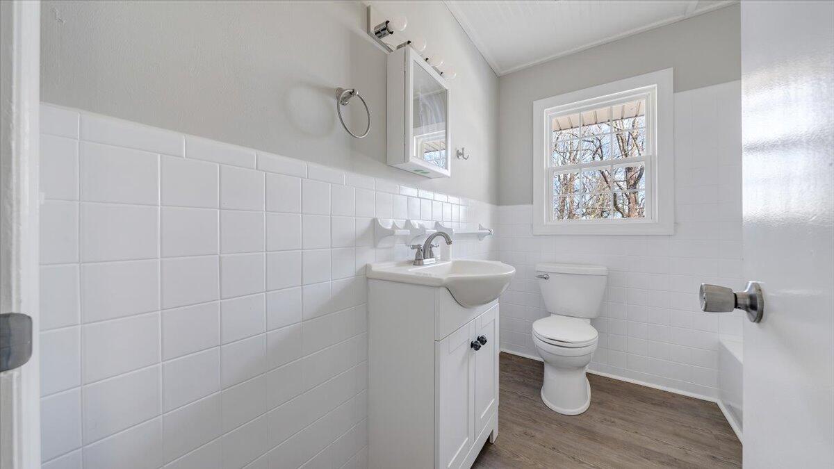200 Cornell Road Rocky Mount, VA 24151 - Photo 16 of 44 a bathroom with a toilet sink and mirror