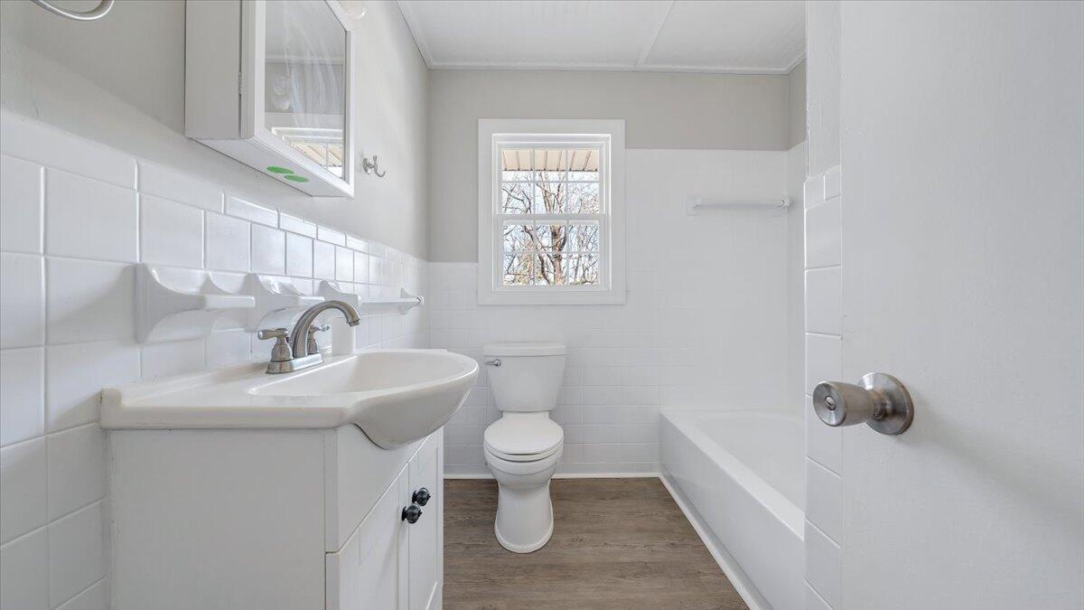 200 Cornell Road Rocky Mount, VA 24151 - Photo 17 of 44 a bathroom with a sink toilet and a bathtub