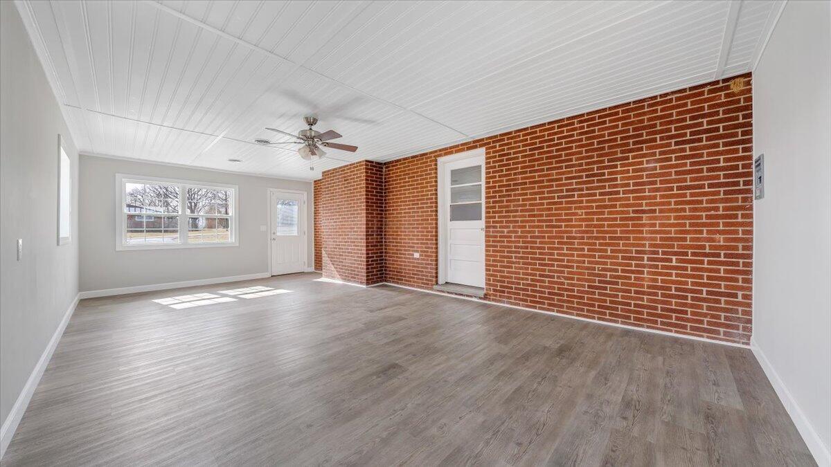 200 Cornell Road Rocky Mount, VA 24151 - Photo 25 of 44 a view of an empty room with a window and wooden floor